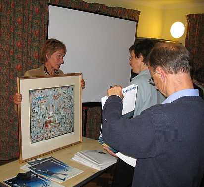 Mrs Woolstenholme holding a tapestry of Everest.