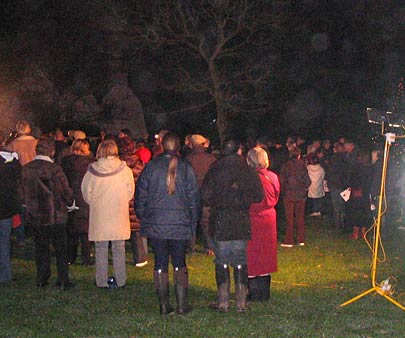 Carols around the tree.