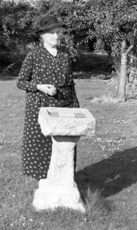 Lady standing by sundail - 1940